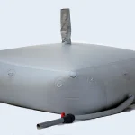 A large, gray Cube collapsible water tank with round corner reinforcement and an attached pipe is depicted against a plain background.