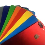 A Heavy Duty Tarpaulin roll laid out alongside a collection of vibrant phone cases in shades of blue, green, orange, yellow, and more.