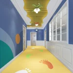 A brightly colored hallway featuring blue walls, a yellow PVC Floor Vinyl, and large, colorful footprint decals. The ceiling is painted yellow with wavy decorative elements and is adorned with green and red bow-shaped lights.